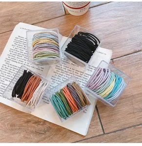 Multicolor seamless hair ties set in clear acrylic boxes, elastic rubber bands for daily use.