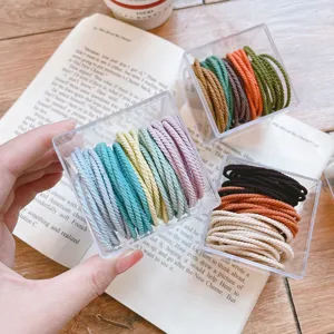 Macaron color elastic hair ties set in clear storage boxes, seamless daily hair accessories.
