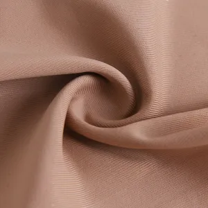 Close-up detail of smooth seamless ice silk underwear fabric in nude color, soft texture.