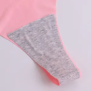 Close-up detail of women's seamless pink thong crotch lining, breathable fabric soft texture.