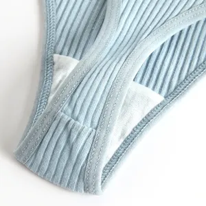 Detail shot of women low waist ribbed solid breathable thong underwear in light blue color.