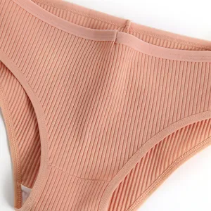 Close-up detail view of women's comfortable ribbed low-waist seamless panty fabric.