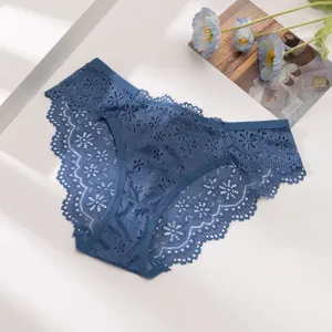 Detail view of blue lace women underwear showing delicate floral hollow lace pattern.