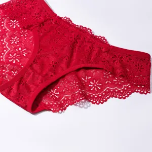 Close-up detail shot of red floral lace panties, breathable hollow-out design, soft underwear.