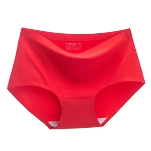 Red seamless women briefs detail view, mid-waist solid color underwear with breathable cotton crotch.