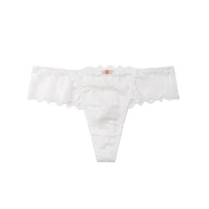 Close-up detail of sexy white lace thong for women, featuring delicate floral lace and bow.