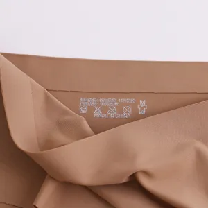 Detail view of seamless women briefs inner label showing fabric composition and size M.