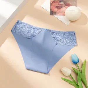 Detail shot of light blue women low rise seamless lace panties with delicate floral waist trim.