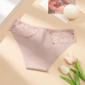 Detail shot of women low rise pink seamless lace patchwork panties with soft breathable fabric.