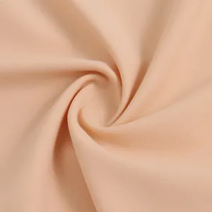 Detailed view of smooth nude fabric, soft texture closeup for high quality underwear apparel.