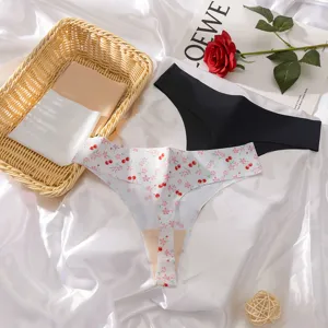 Women's seamless ice silk low-rise thong underwear, cherry floral pattern and solid color detail shot.