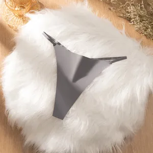 Detail shot of solid gray seamless low-waist women thong displayed on fluffy white mat.
