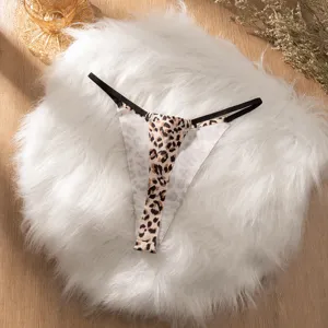 Detailed view of women's leopard print low-waist thong, soft breathable seamless fabric.