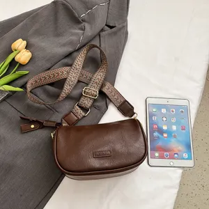 Vintage braune Leder-Umhängetasche mit stylischem Webgurt, perfekte tägliche Handtasche.