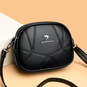 Schwarze Umhängetasche aus Leder mit geometrischen Nähten, elegante kleine Damen-Runde Tasche.