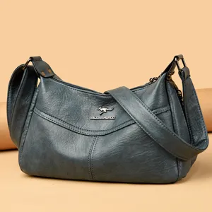 Weiche Leder-Umhängetasche Detail zeigt feine Textur, geräumigen Innenraum und Hardware.