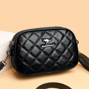 Elegante schwarze Umhängetasche aus gestepptem Leder für Damen mit praktischen Fächern.