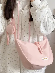 Schicke rosa Umhängetasche aus Canvas im Knödel-Design mit Münztasche, ideal für Studenten.