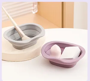 Foldable silicone brush cleaning bowl detail showing texture and tool placement for makeup use.