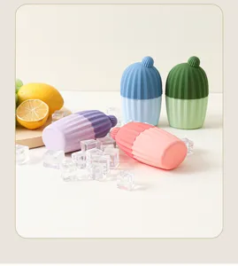 Silicone facial ice roller detail showing vibrant color capsules and fresh fruit prop setup.