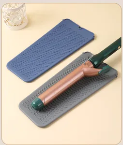 Tappetino in silicone resistente al calore per arricciacapelli e protezione antiscottatura.