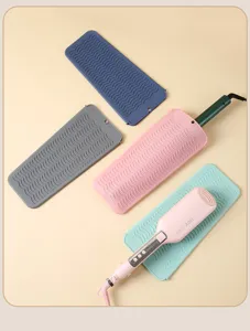 Tappetino termoresistente in silicone per piastra capelli, design ondulato antiscivolo sicuro.