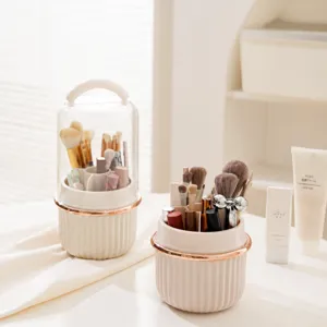 Rotating makeup brush organizer with dust-proof cover, partitioned cosmetic storage holder.