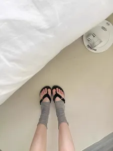 Summer ultra-thin Korean style sheer socks paired with chic black flip flop sandals detail shot.