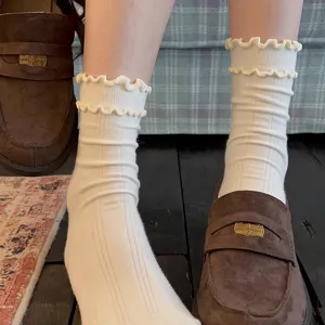 White ruffle mid-calf socks for women, cozy ballet style cotton knit socks detail.