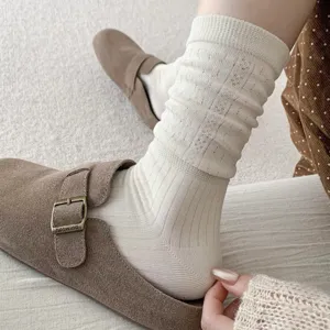 Vintage hollow wheat pattern mid-tube women socks, comfortable casual daily wear style.