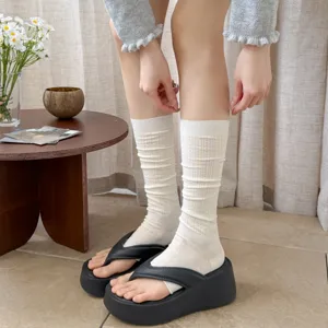 White hollow out long socks detail, breathable mesh stacking socks close up view
