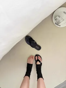 Summer thin black stirrup socks detail, breathable sheer sock with chic sandal combination.