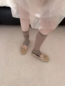 Korean style thin stacked leg warmers paired with ballet flats for spring summer daily wear.