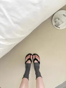 Summer thin gray leg warmers stirrup socks with comfortable minimalist sandals for daily wear.