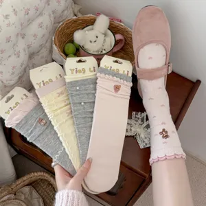 Cute embroidered bear slouch socks detail, sweet bow and lettuce edge mid-tube sock.