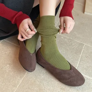 Retro hollow-out knit mid-calf socks detailed view, paired with brown suede flat shoes for daily us.
