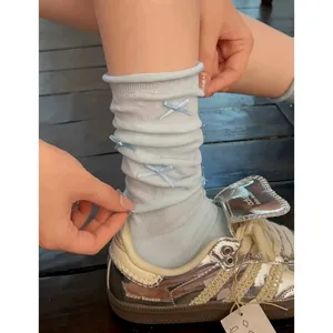 Light blue ballet style bow stack socks for women, sweet JK cute calf crew socks.