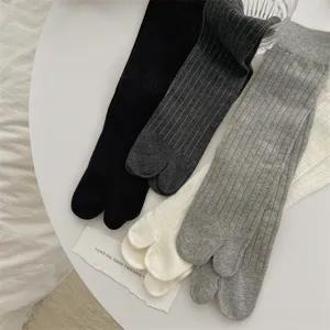 Ribbed tabi socks set featuring comfortable split-toe design in multiple versatile colors.