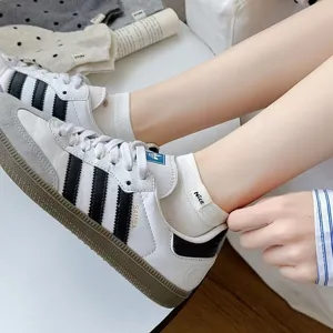 Close-up detail of women's short socks with cute Nice cloth label, breathable cotton material.