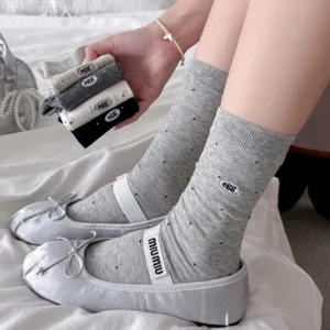 Grey polka dot mid-calf socks with cute egg embroidery and cute bow ballet flats detail shot