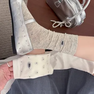 Detail view of Korean style dot mid-calf socks with cute egg embroidery for daily wear.