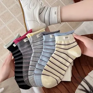 Korean style colorful striped mid-tube socks with cute egg label, main display view.