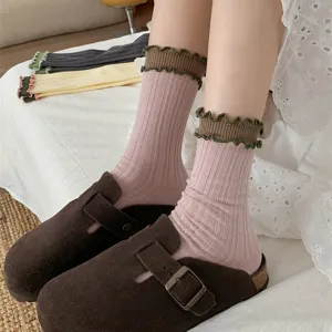 Detail view of Japanese sweet lettuce edge mid-calf socks with contrast color double layer ribbed cuff.