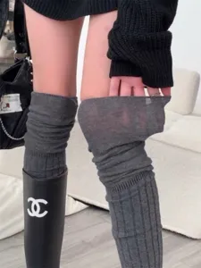 Grey over-the-knee knit socks detail showing soft fabric texture and elasticity.