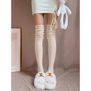 Cozy knit over-the-knee long socks for women, solid color slouchy boot stockings for stylish daily wear.