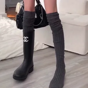 Grey over the knee knit socks for women, stylish long boot matching cozy winter hosiery.
