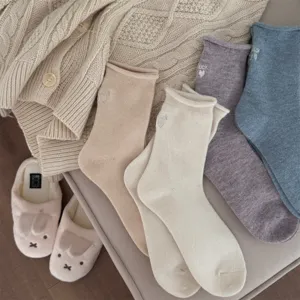 Cozy knit winter socks with cute letter embroidery and rolled cuffs for daily warm wear.