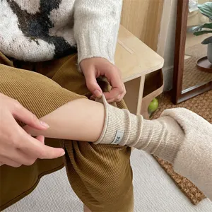 Cozy knit slouch socks with small label, solid color warm winter casual socks for women.
