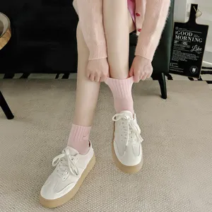 Pink cotton short socks with cute cat embroidery, college style detail view for casual wear.