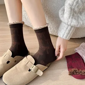 Cozy brown mid-tube socks featuring an all-over bow jacquard pattern and contrast bubble cuffs.